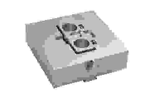Sample stage with piezoscanner and 2-axis microforce sensing probe for scratch material testing.