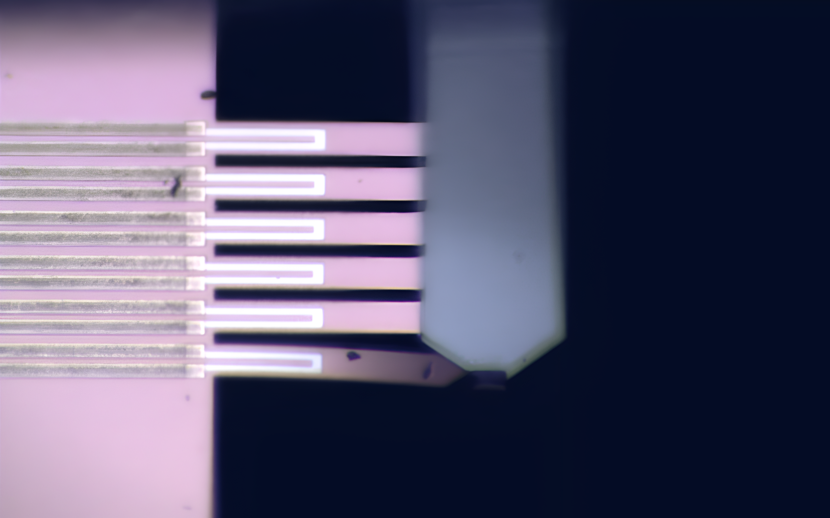 <p>MEMS testing apparatus measuring stiffness in micro-manufactured components for yield calculation.</p>