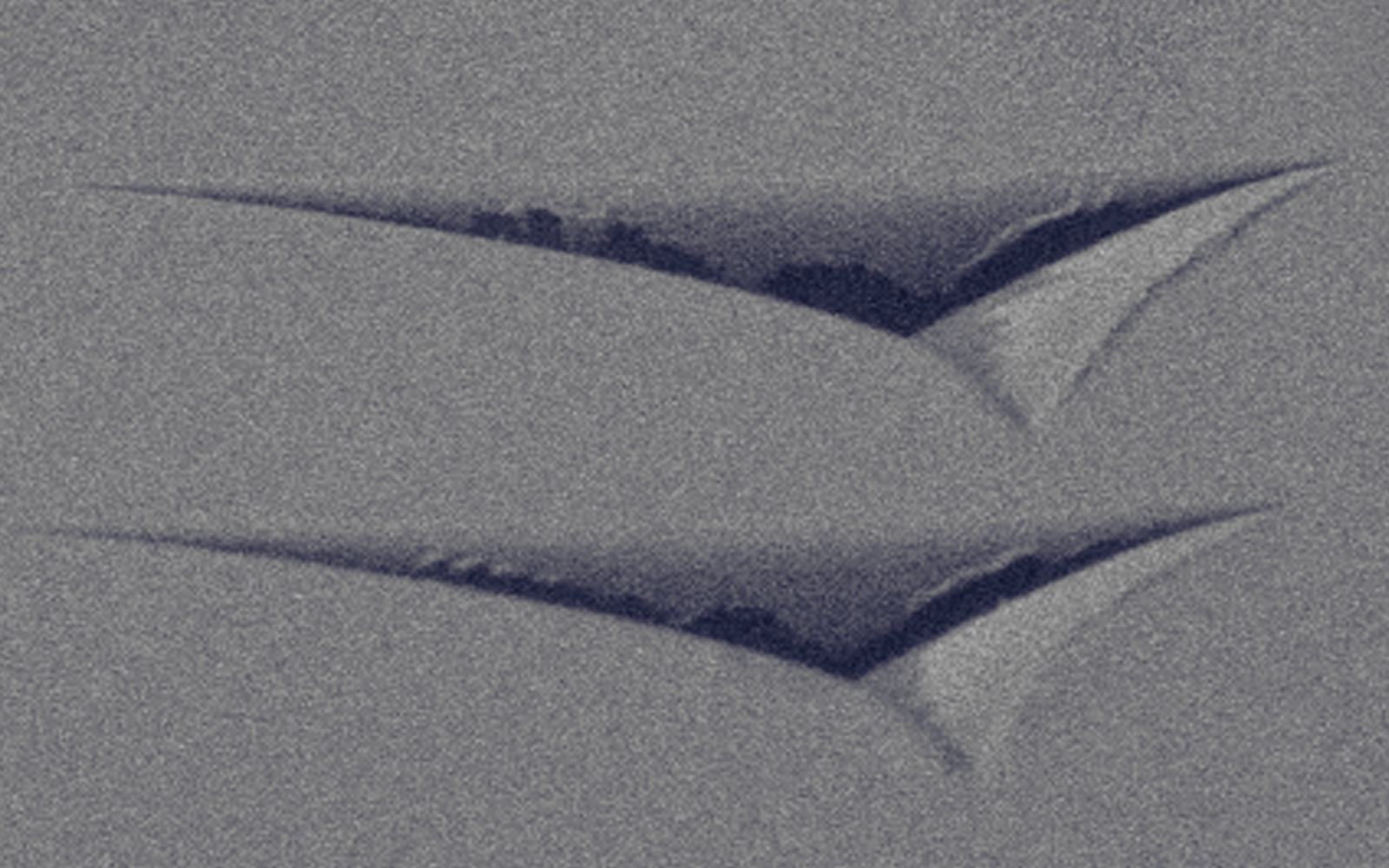 <p>SEM image of Berkovich indentations revealing mechanical properties of a material via nanoindentation.</p>