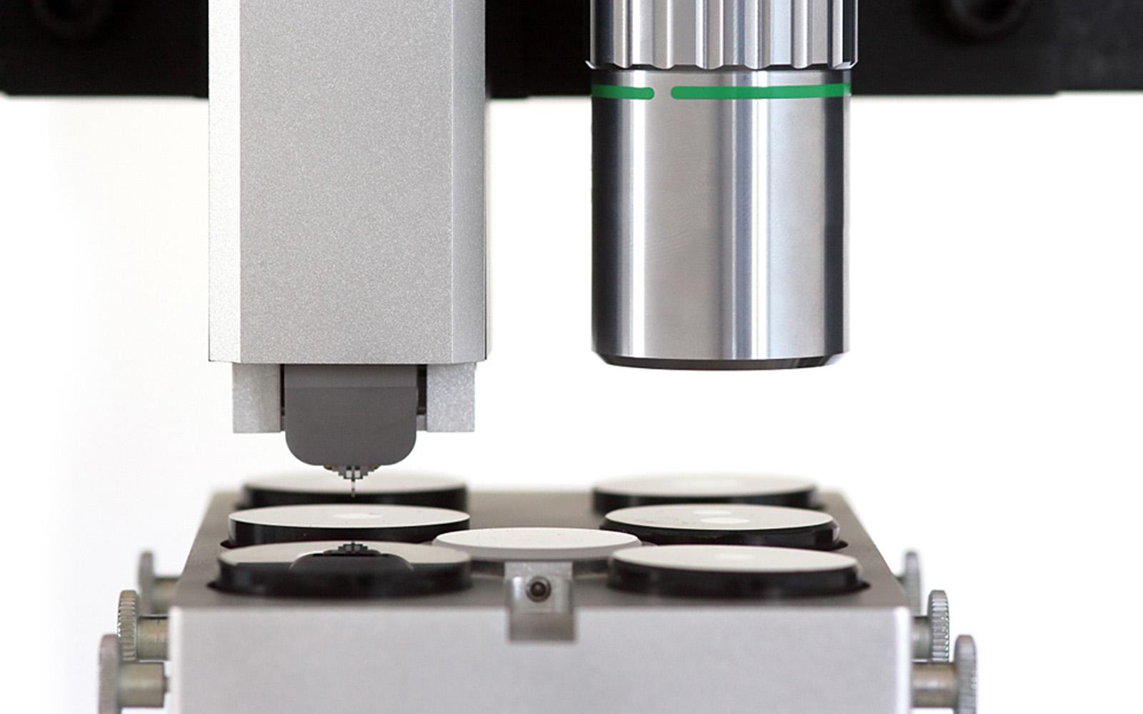 <p>Side view of i04 Femto-Indenter highlighting the tip and sample stage for nanoscale testing.</p>