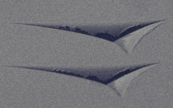 <p>SEM image of Berkovich indentations revealing mechanical properties of a material via nanoindentation.</p>